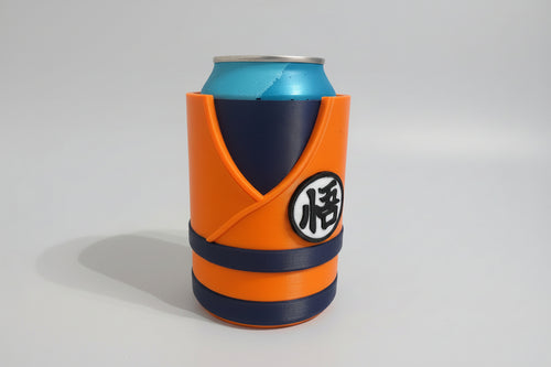 DBZ Can coolers with orange, blue, and black design on a textured surface