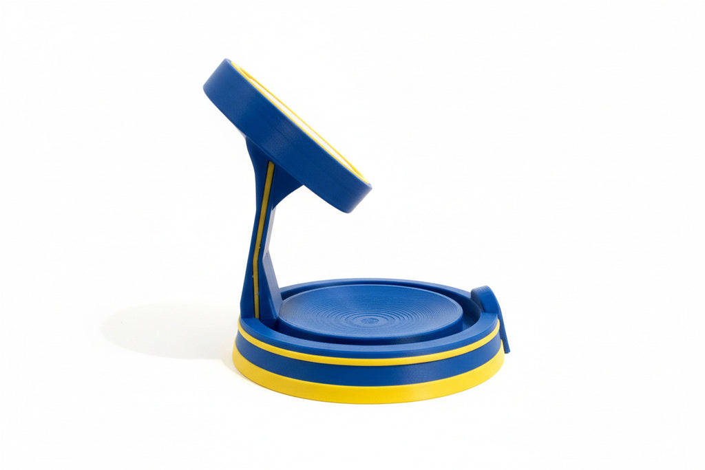 Blue and yellow fallout inspired MagSafe mount on a textured surface with a plain background