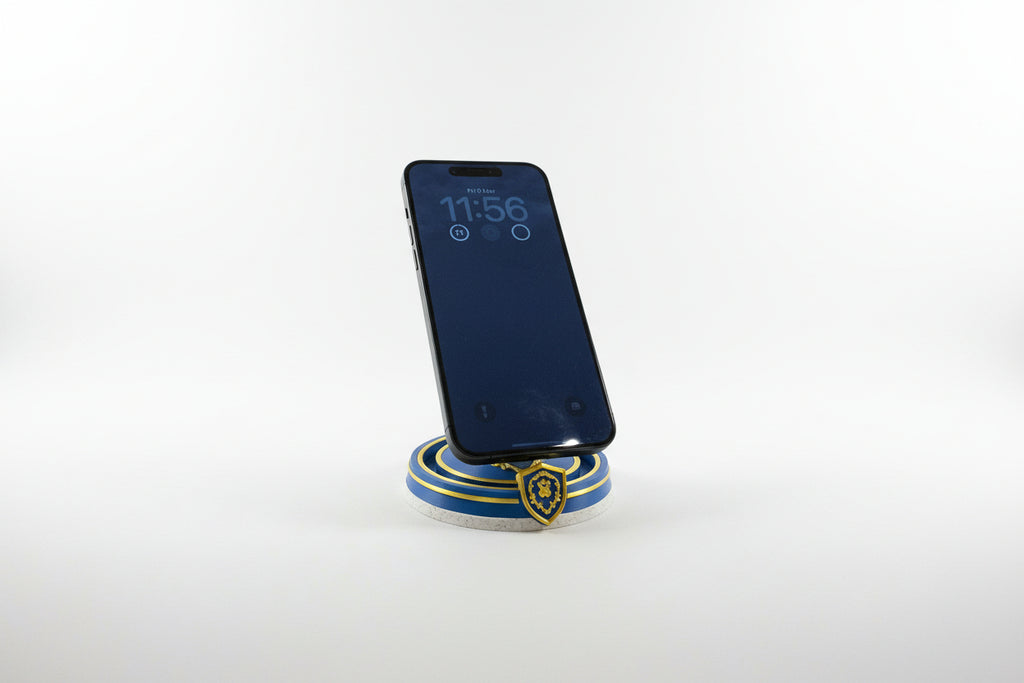 Phone on a Alliance themed magssafe charger and stand