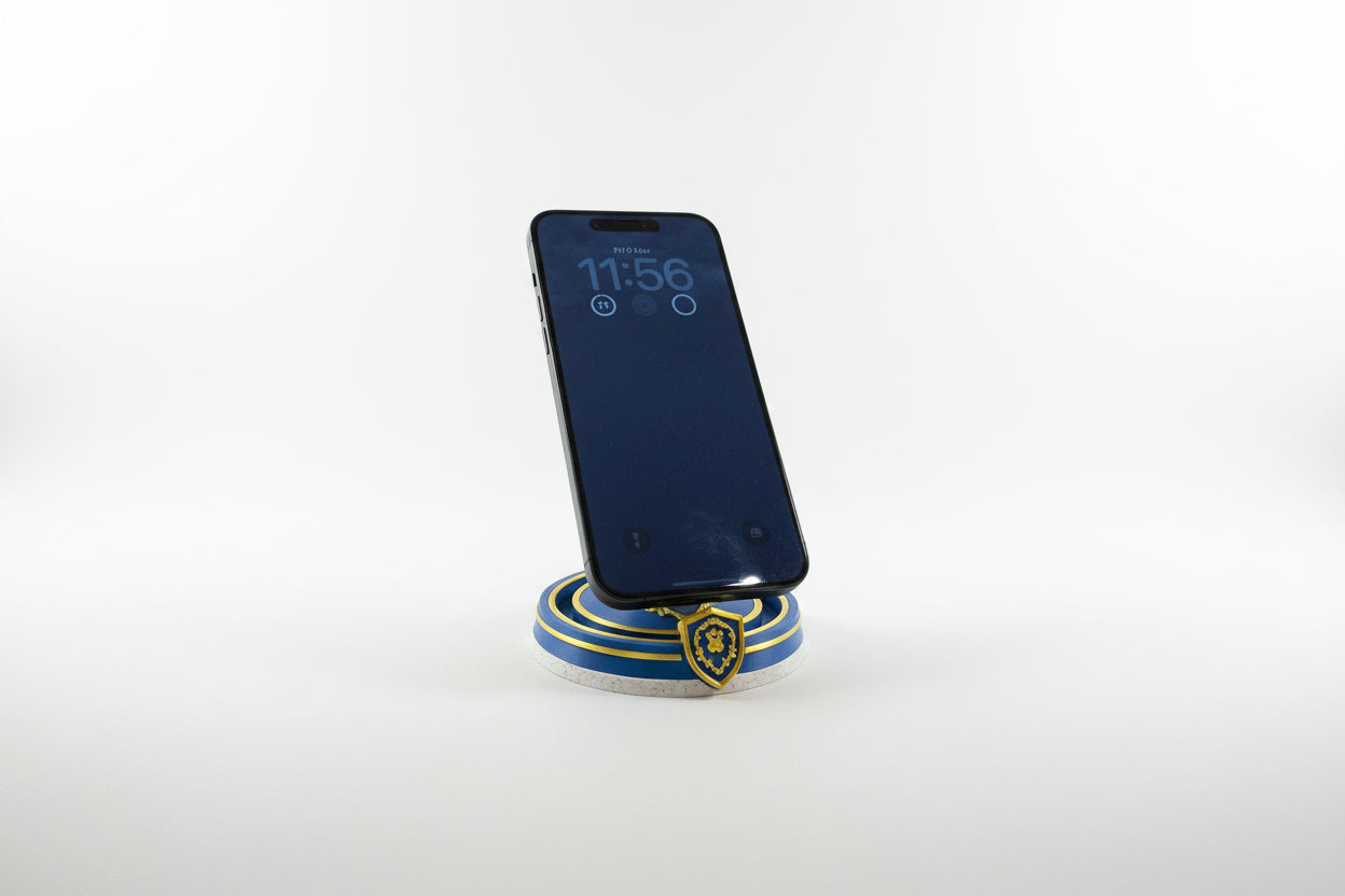 Phone on a Alliance themed magssafe charger and stand