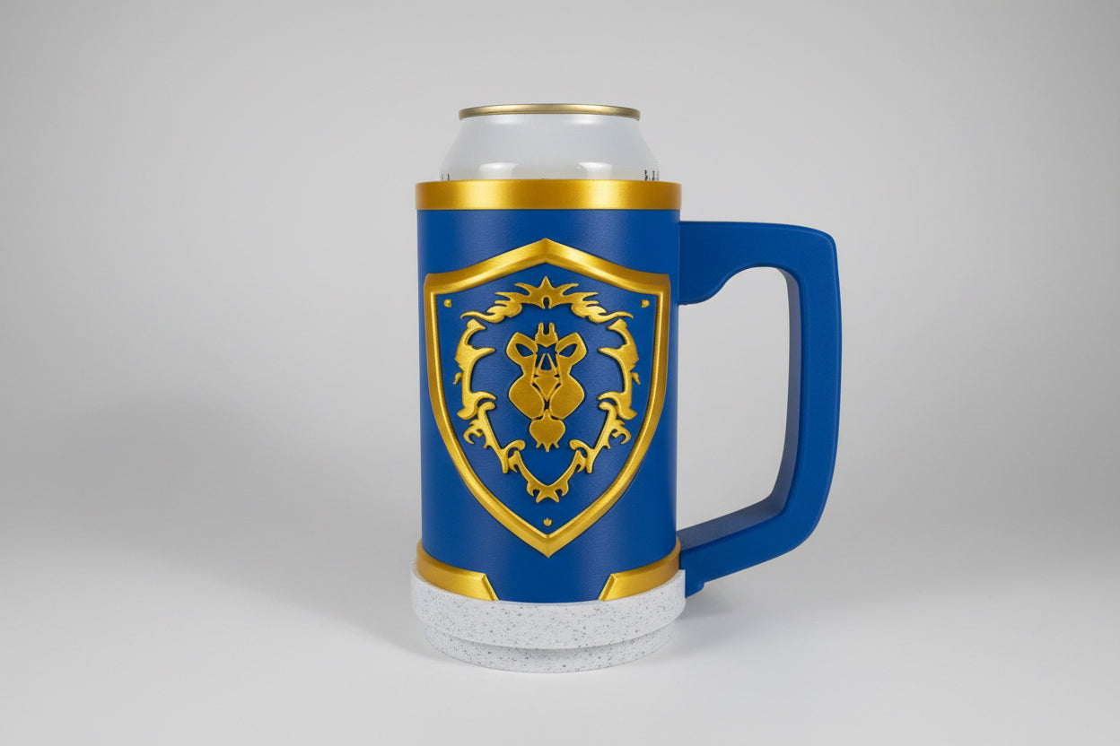 Blue alliance world of Warcraft mug with gold emblem holding a can on a gray surface