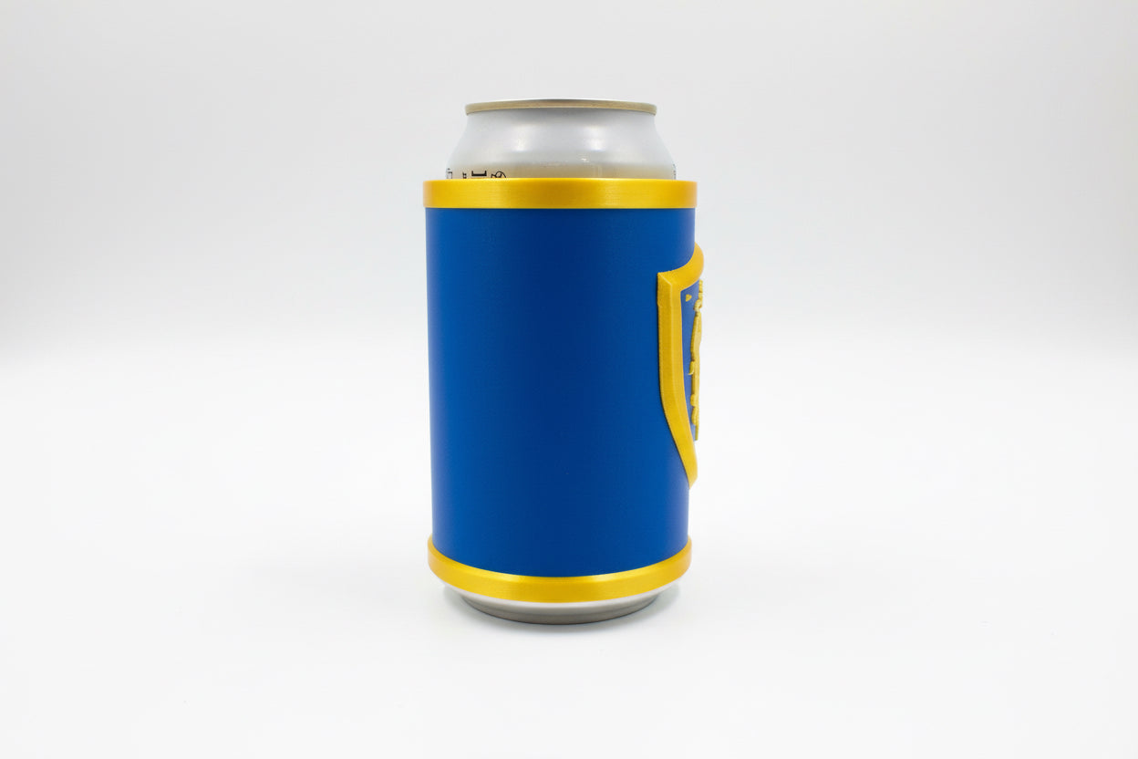 Blue alliance world of Warcraft can cooler with gold accents on a gray surface
