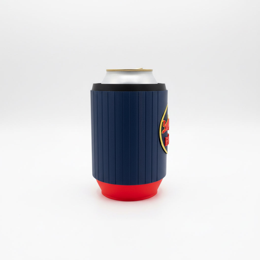 Blue red bull can cooler with red bottom holding a white can on a gray surface.
